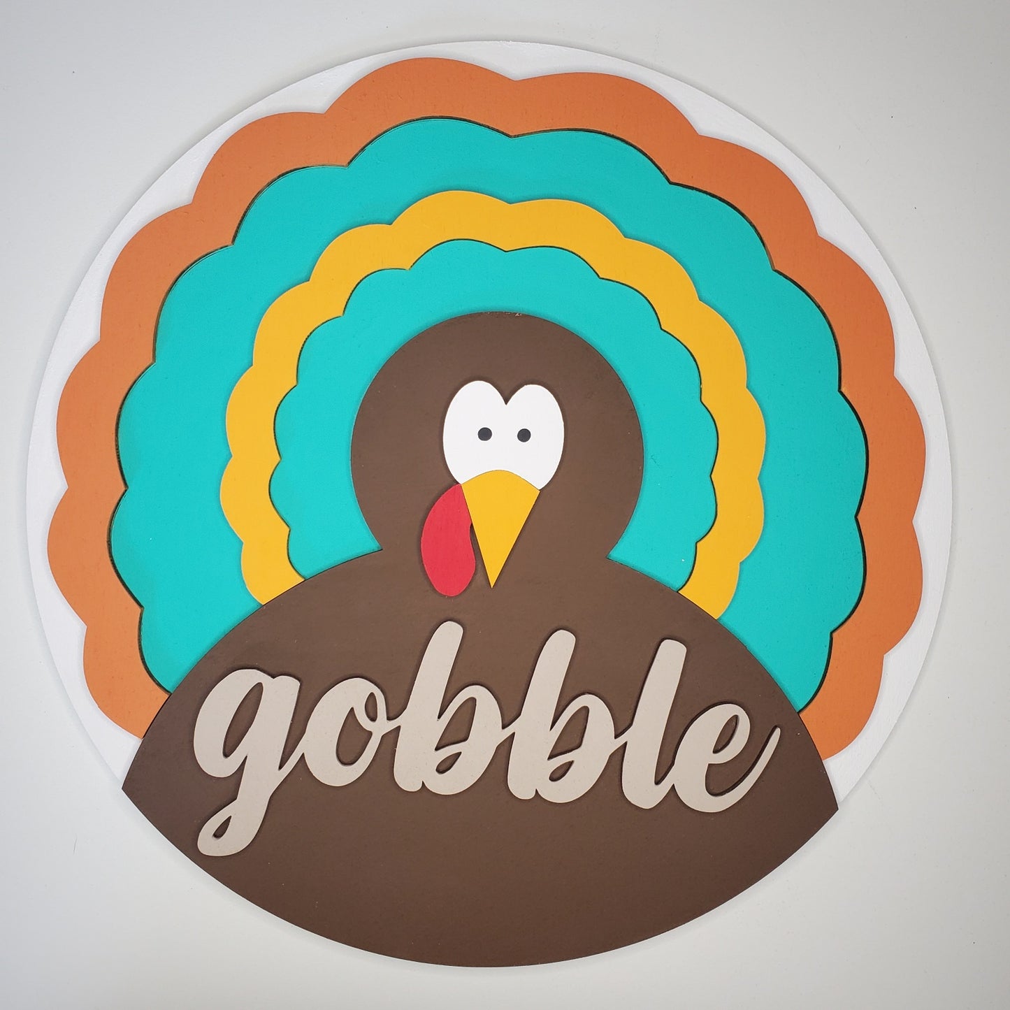 Colorful turkey graphic with 'gobble' text on a white background
