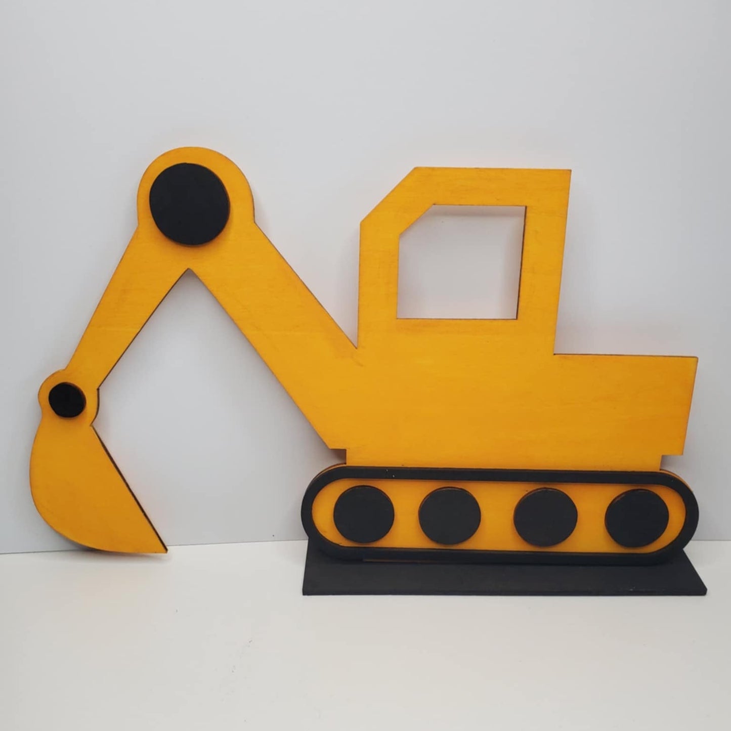 A Laser cut wood excavator hand painted and ready to display