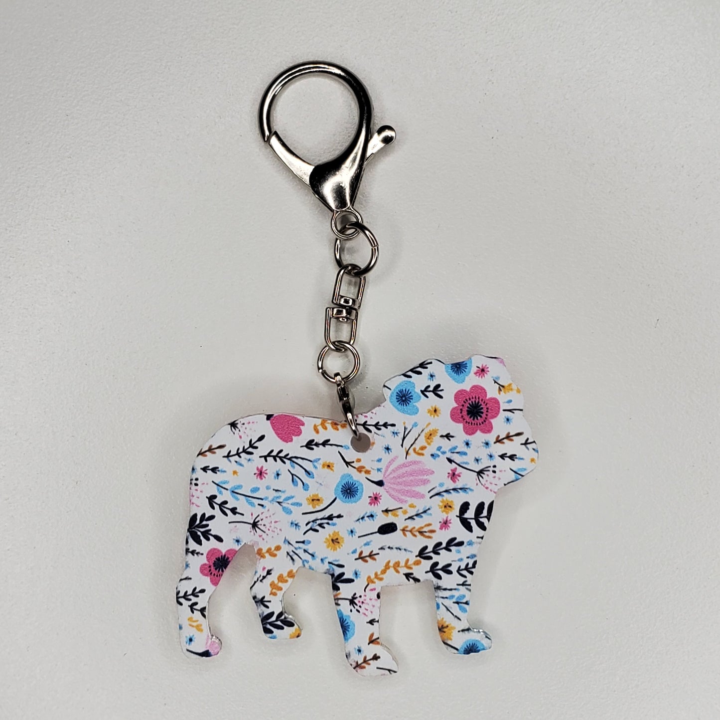 Designed and handmade acrylic purse charm in dog breed English Bulldog. With large lobster claw to attach easily.