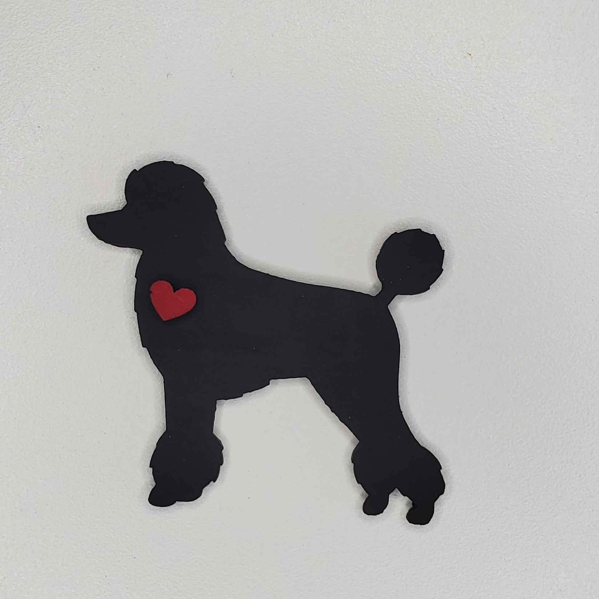 Laser cut wood dog. Hand painted color Tricorn Black Poodle magnet adorn with a heart.