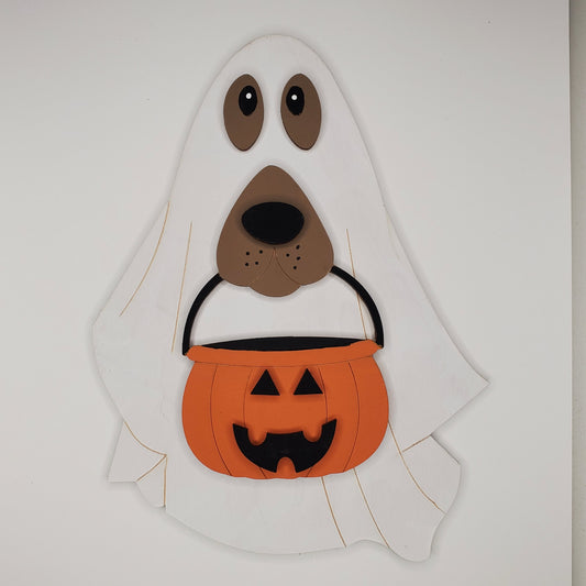 Halloween-themed wooden dog with ghost headpiece and jack-o'-lantern pumpkin bucket. DIY and finished piece available