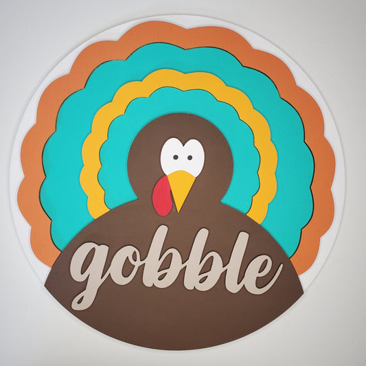 Colorful turkey graphic with 'gobble' text on a white background