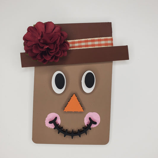 Wooden Scarecrow Decor with Face and Flower Accent