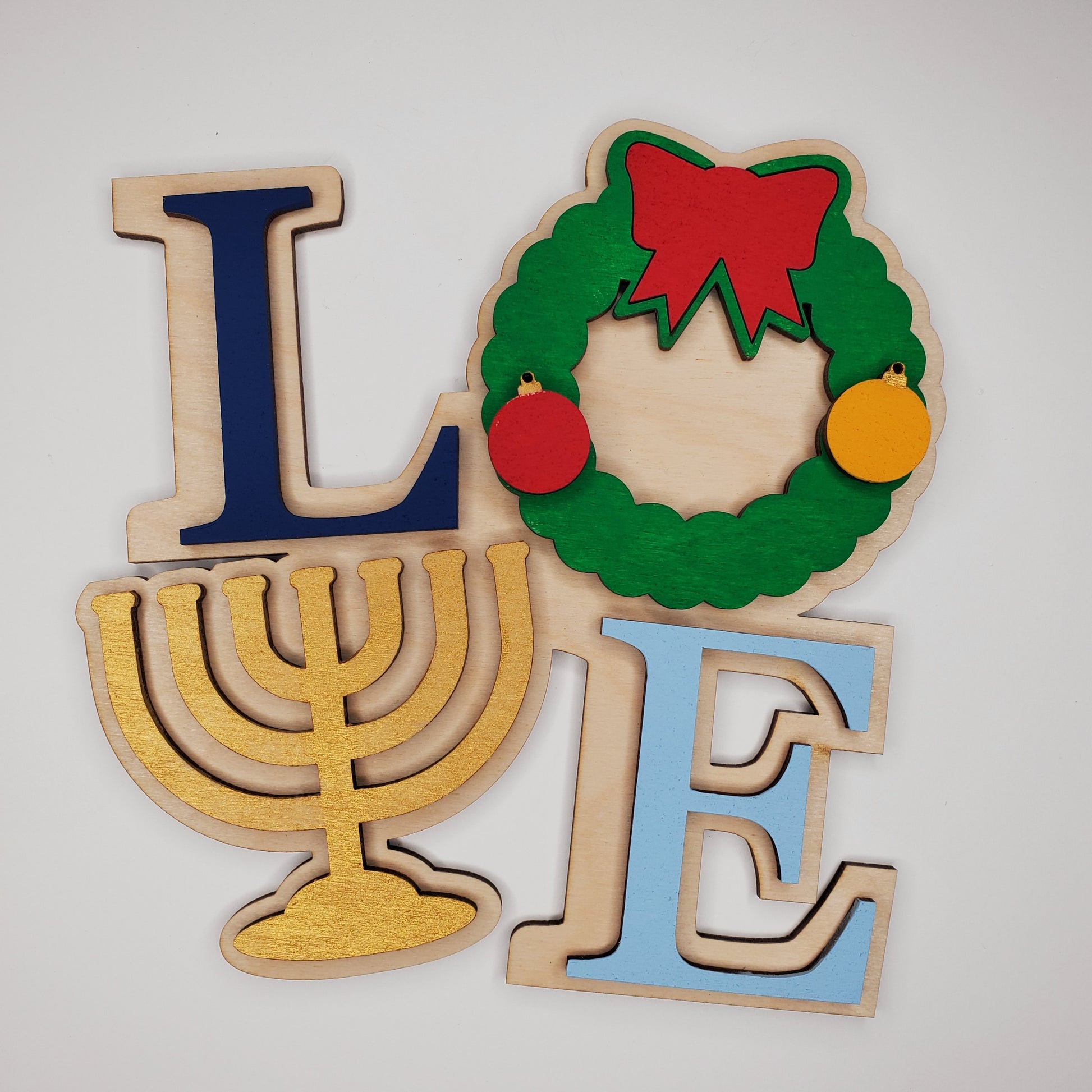 Wooden Hanukkah-themed Love shelf sitter with wreath and menorah