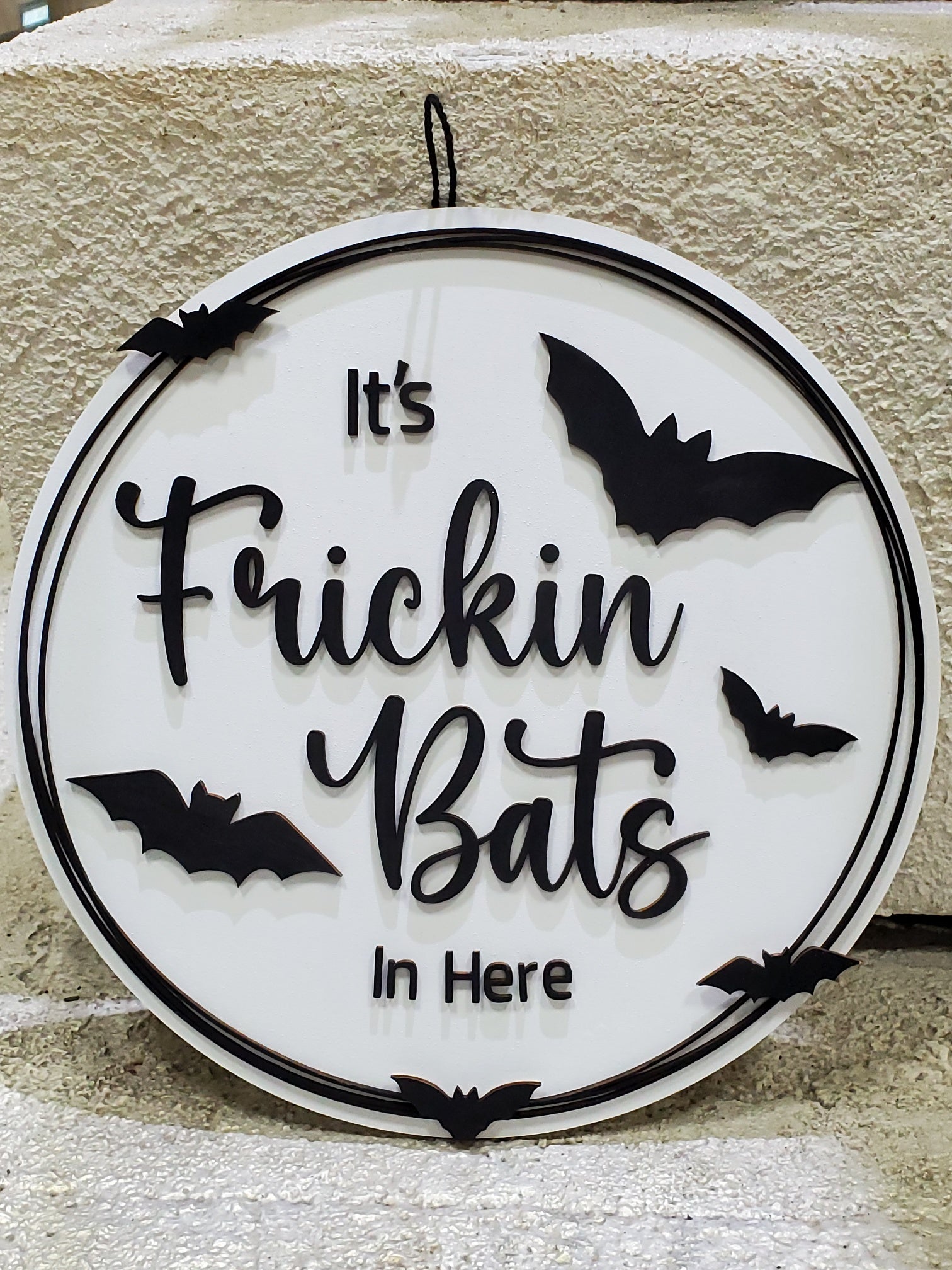 Decorative sign with 'It's Frickin Bats In Here' text and bat illustrations on a door round to hang or display. Available in finished or unfinished DIY  kit.
