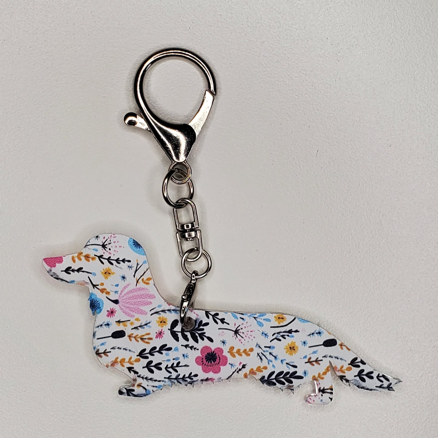 Keychain with itty bitty ditsy floral design.  Long hair dachshund
