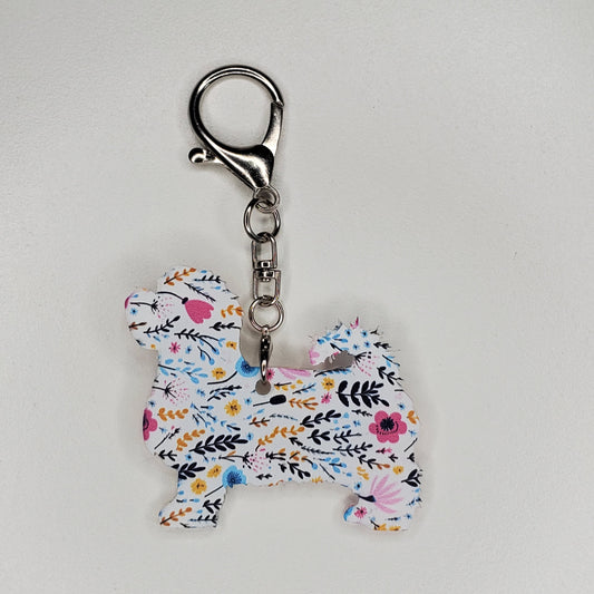 Floral-patterned purse charm shaped like a dog, Maltese, handmade.
