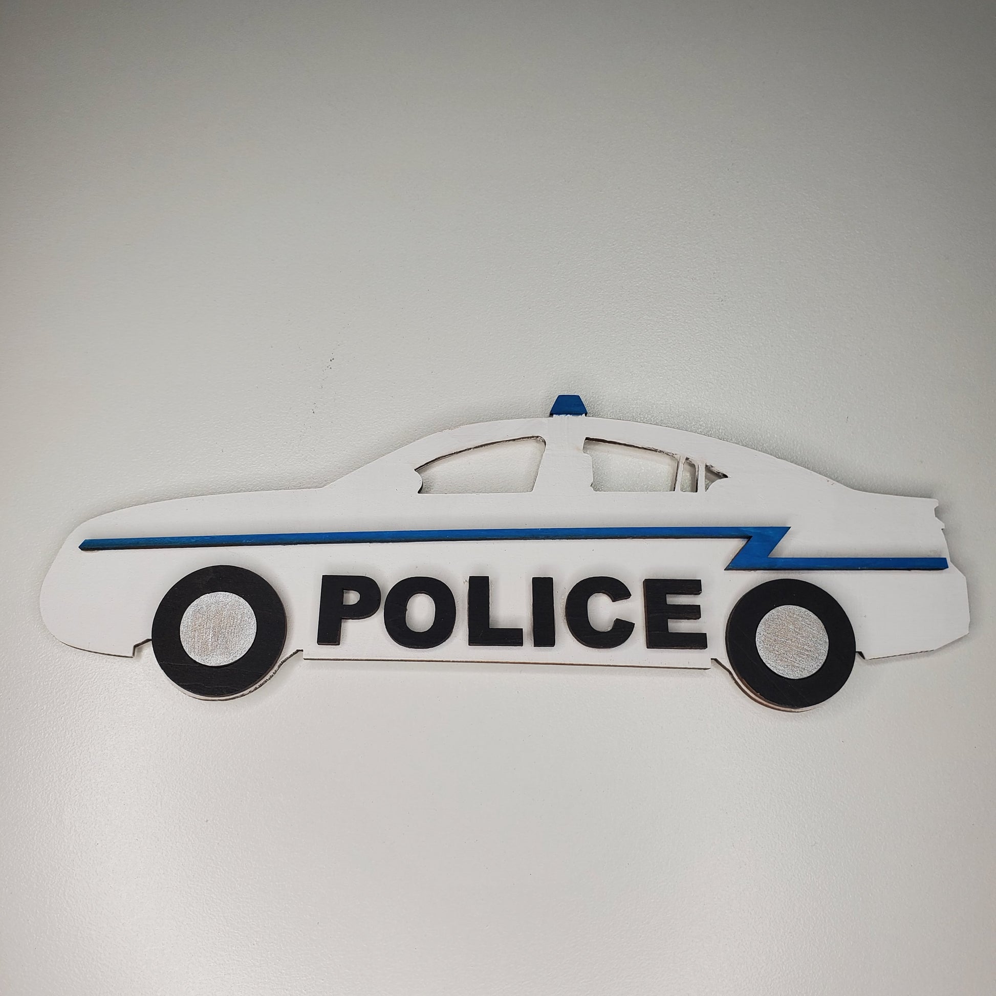 Decorative police car model on a gray background